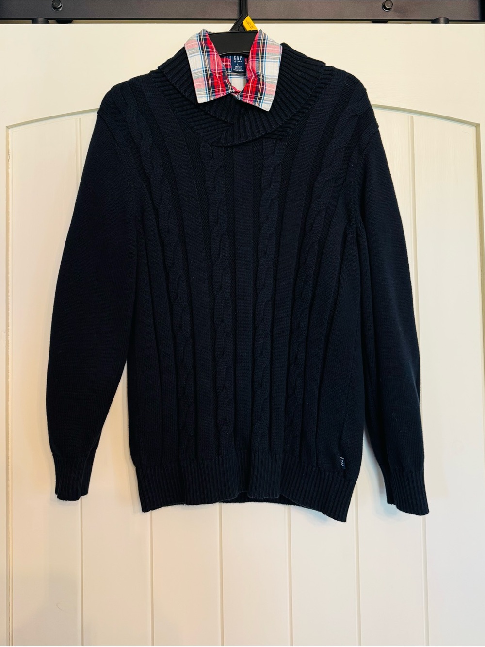 Gap Boy’s Navy Cable-Knit Sweater with long sleeved collar shirt underneath.